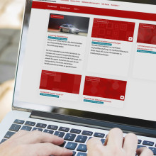 Person working on a laptop displaying the Austrian Red Cross course portal